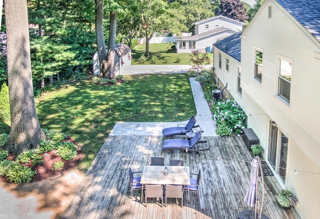 view of yard featuring an outbuilding and outdoor dining space