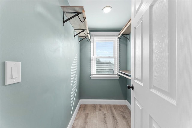 spacious closet with light wood-style flooring