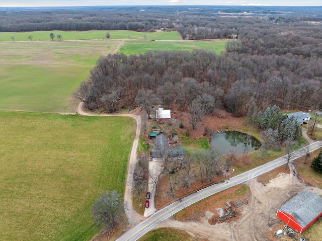 drone / aerial view featuring a forest view