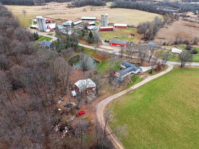 birds eye view of property with a rural view