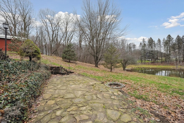 view of patio featuring a water view