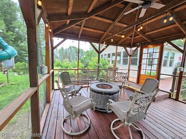 wooden deck with a fire pit