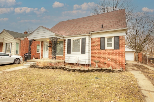 bungalow-style home with covered porch, a garage, brick siding, fence, and roof with shingles