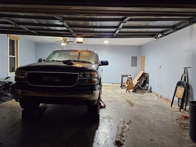 garage featuring electric panel and a garage door opener