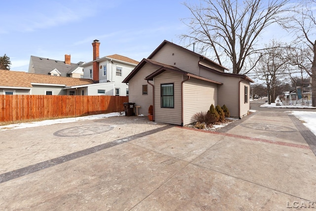 rear view of house with fence