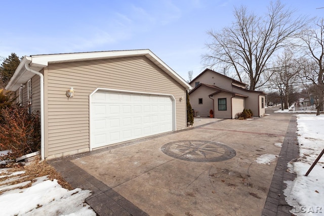 exterior space with a detached garage