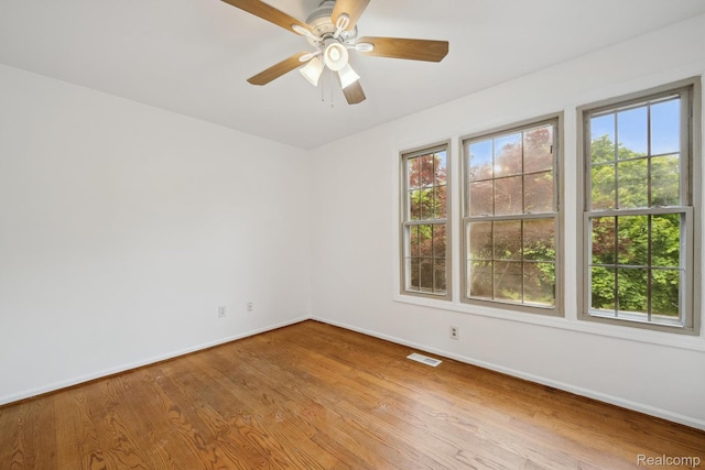 1869 Midchester Dr, West Bloomfield, MI 48324 - unfurnished room featuring baseboards, wood finished floors, and ceiling fan