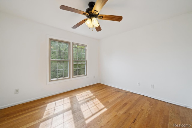 1869 Midchester Dr, West Bloomfield, MI 48324 - spare room featuring light wood finished floors, baseboards, and ceiling fan