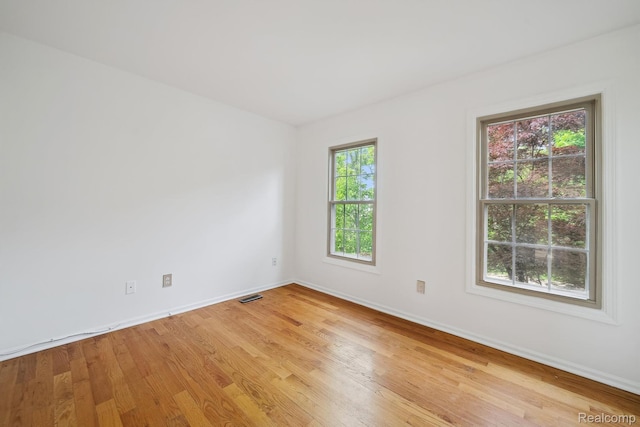 1869 Midchester Dr, West Bloomfield, MI 48324 - spare room with light wood finished floors and baseboards