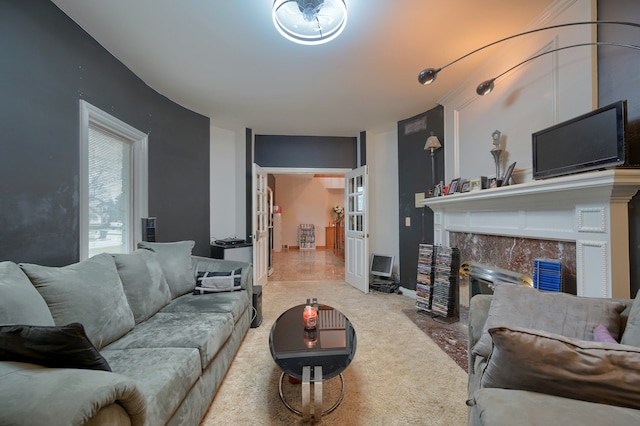 living room with light carpet and a fireplace