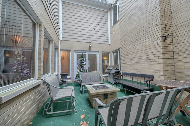 view of patio featuring an outdoor living space with a fire pit and area for grilling