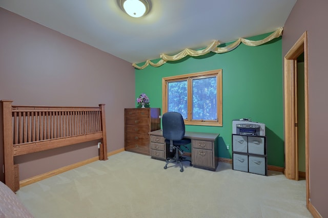 office with light carpet and baseboards