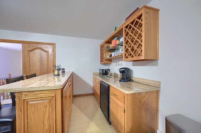 kitchen featuring a breakfast bar, light floors, open shelves, light countertops, and a peninsula