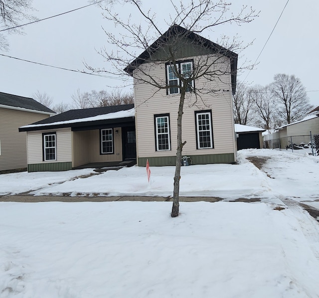 traditional-style house with a detached garage