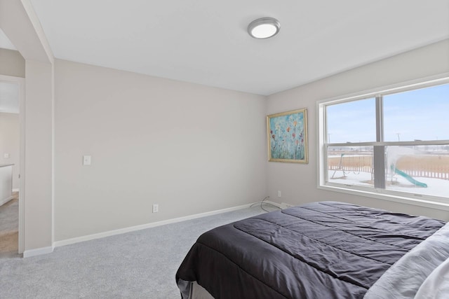 carpeted bedroom with baseboards