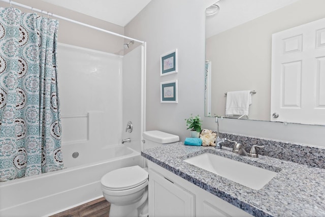 full bathroom with toilet, shower / tub combo, wood finished floors, and vanity