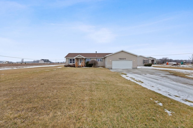 ranch-style house with a front yard, driveway, and an attached garage