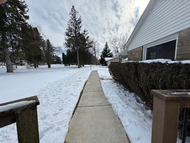 view of yard layered in snow