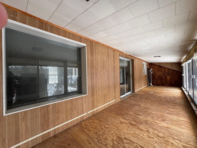 interior space with wood walls and a wealth of natural light