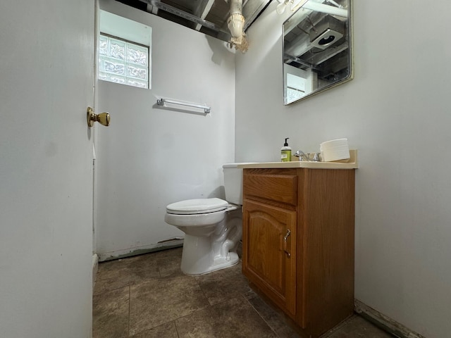 bathroom with toilet and vanity