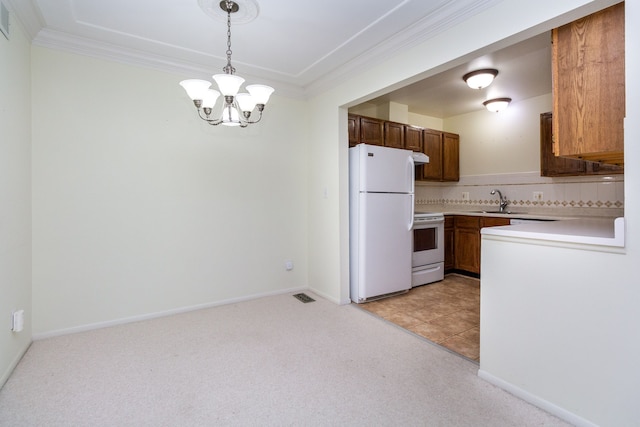 kitchen with brown cabinets, light colored carpet, light countertops, hanging light fixtures, and white appliances