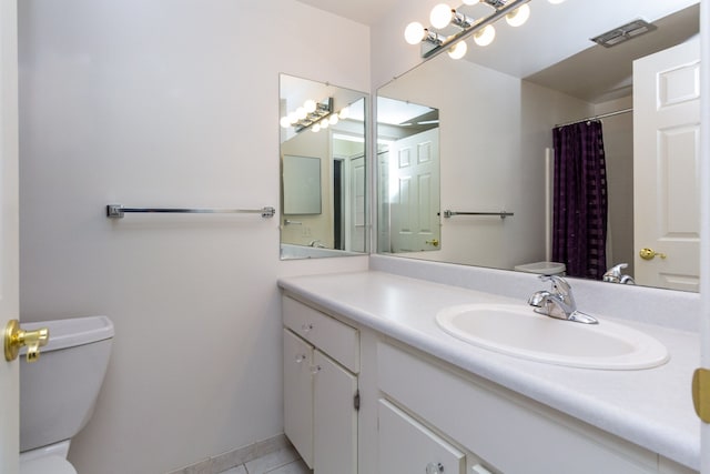 full bathroom featuring visible vents, a shower with shower curtain, toilet, tile patterned floors, and vanity