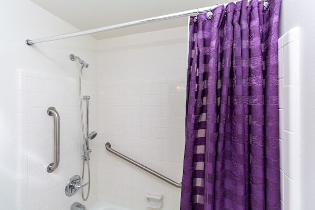 full bath featuring shower / tub combo with curtain