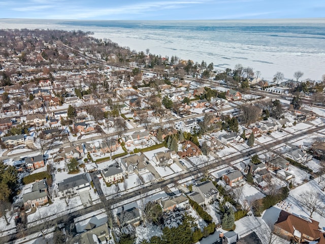 drone / aerial view featuring a water view and a residential view