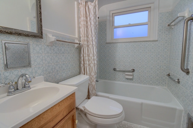 full bathroom featuring tile walls, vanity, toilet, and shower / bath combo with shower curtain