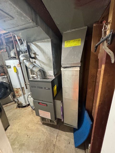 utility room featuring washer / clothes dryer and gas water heater