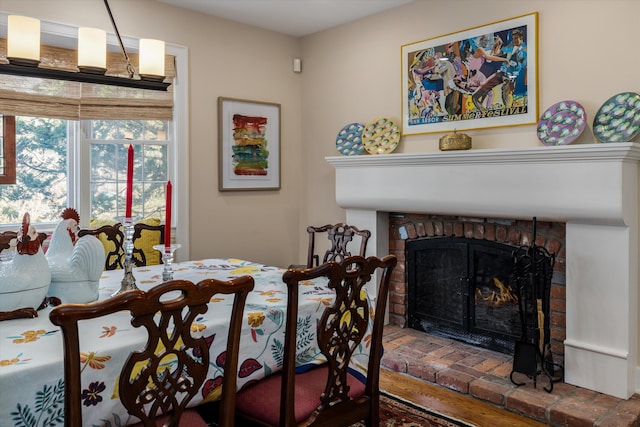 dining area featuring a brick fireplace