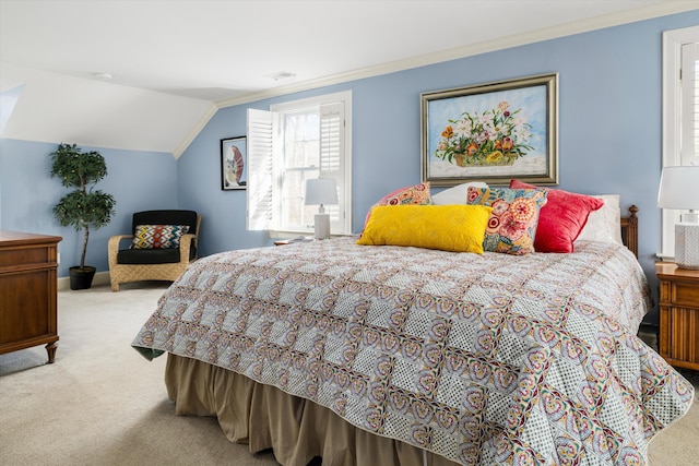 carpeted bedroom with visible vents, ornamental molding, and vaulted ceiling