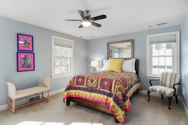 bedroom with ceiling fan, carpet, visible vents, and baseboards