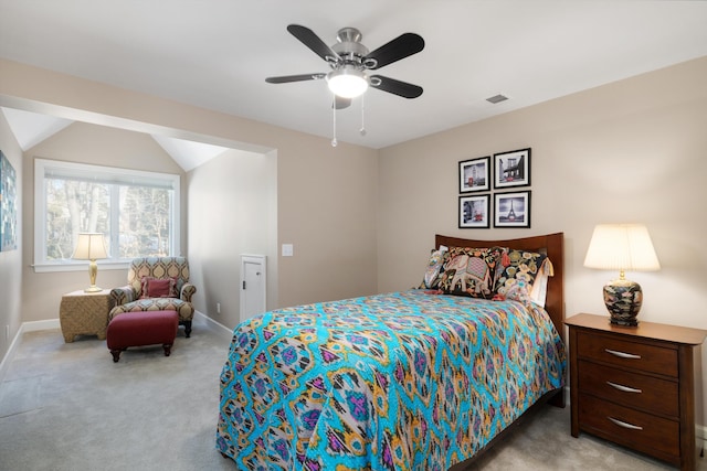 bedroom with lofted ceiling, carpet flooring, and baseboards