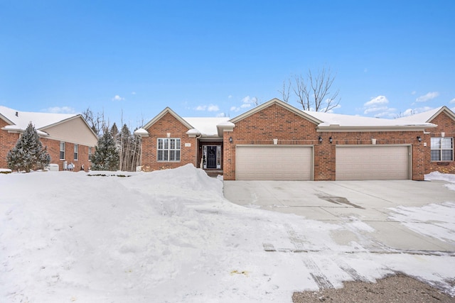 ranch-style home featuring brick siding and an attached garage