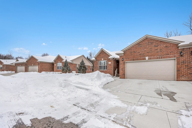 single story home with brick siding and an attached garage