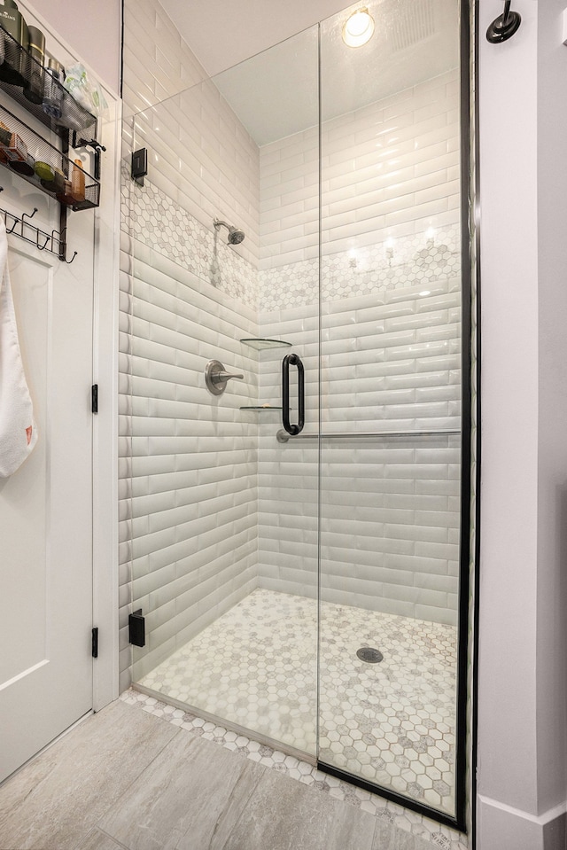 bathroom with a shower stall