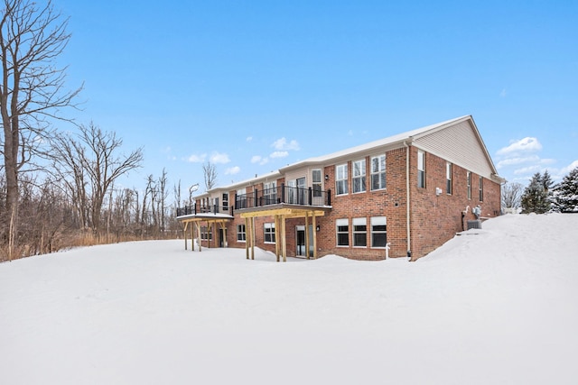 12341 Twin Brook Dr, Romeo, MI 48065 - snow covered house featuring brick siding