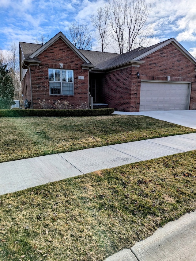 12341 Twin Brook Dr, Romeo, MI 48065 - ranch-style house featuring an attached garage, brick siding, a front lawn, and driveway