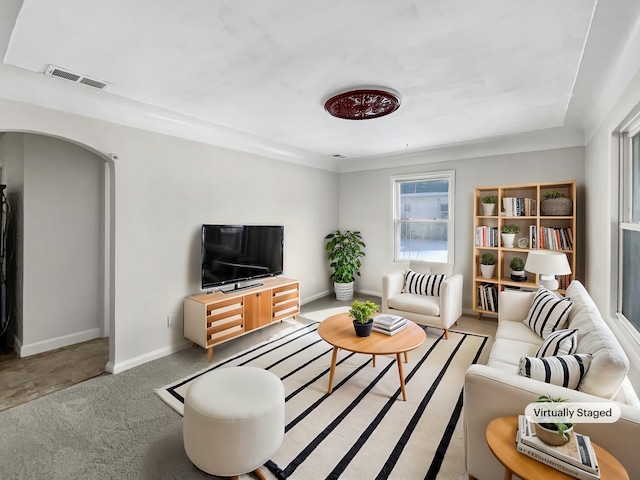 23432 Cayuga Ave, Hazel Park, MI 48030 - living area with arched walkways, light carpet, baseboards, and visible vents