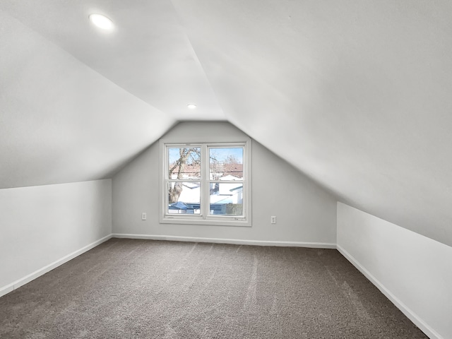 additional living space featuring vaulted ceiling, recessed lighting, carpet flooring, and baseboards