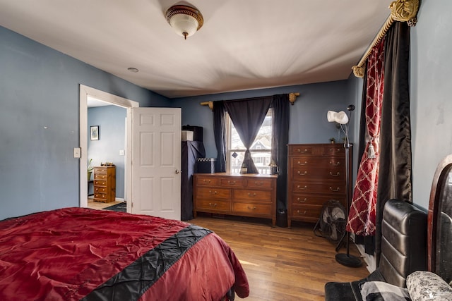 bedroom with wood finished floors