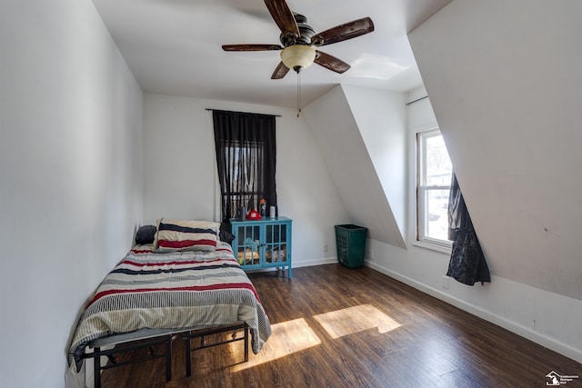 bedroom featuring dark wood-style floors, ceiling fan, and baseboards