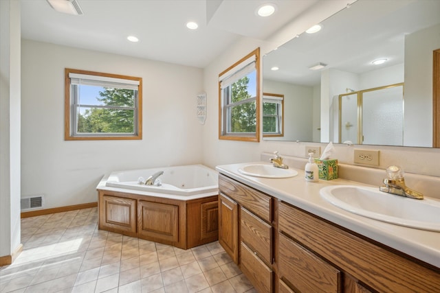 bathroom featuring plenty of natural light, visible vents, and a sink