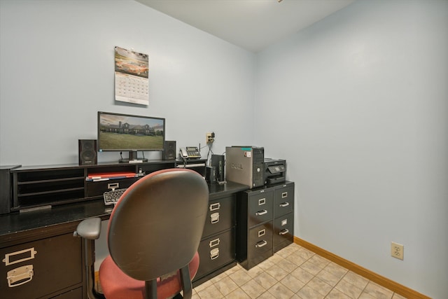 office featuring light tile patterned floors and baseboards