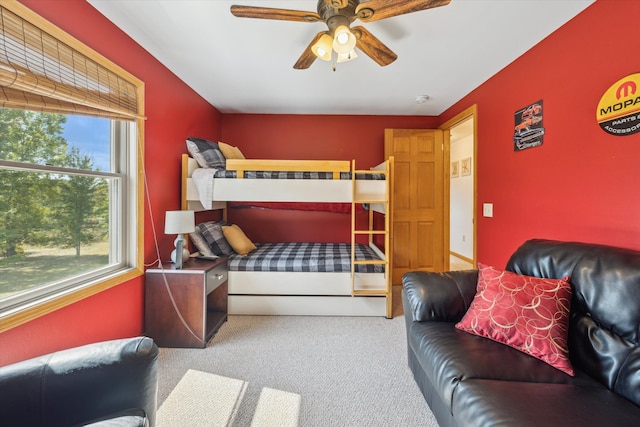 carpeted bedroom with a ceiling fan