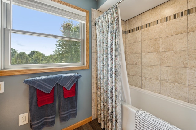 bathroom with shower / bath combo with shower curtain