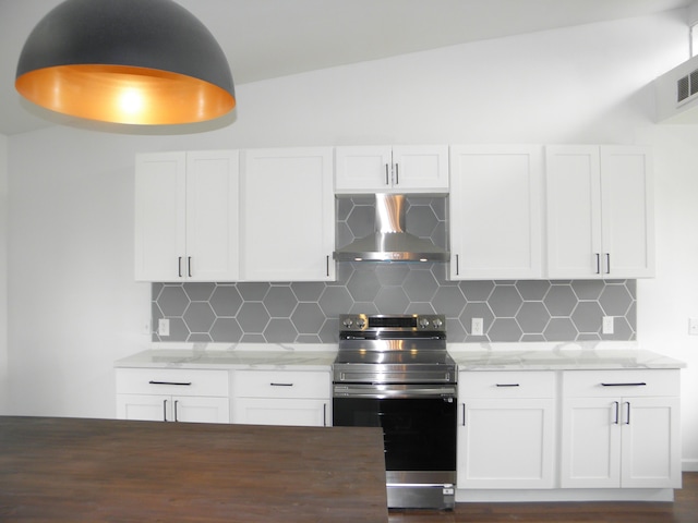 kitchen featuring decorative backsplash, wall chimney exhaust hood, light stone counters, stainless steel range with electric cooktop, and white cabinetry