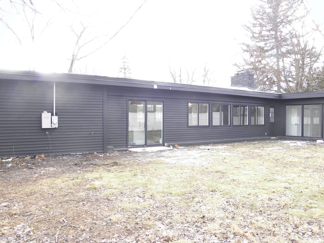 rear view of house with a chimney