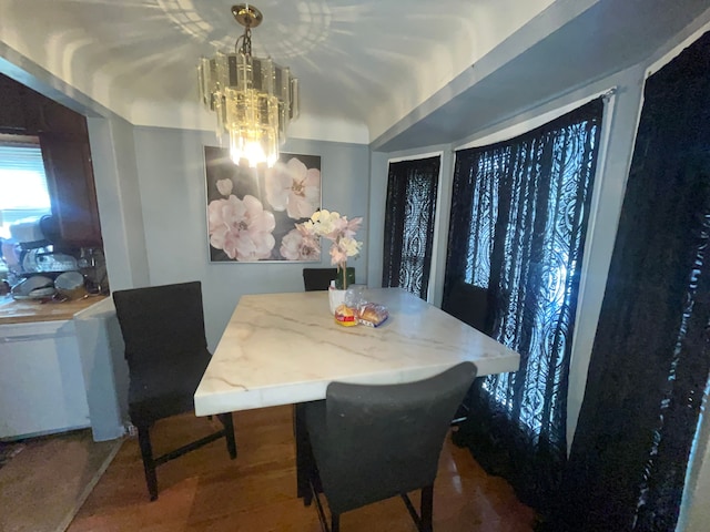 dining area featuring a notable chandelier